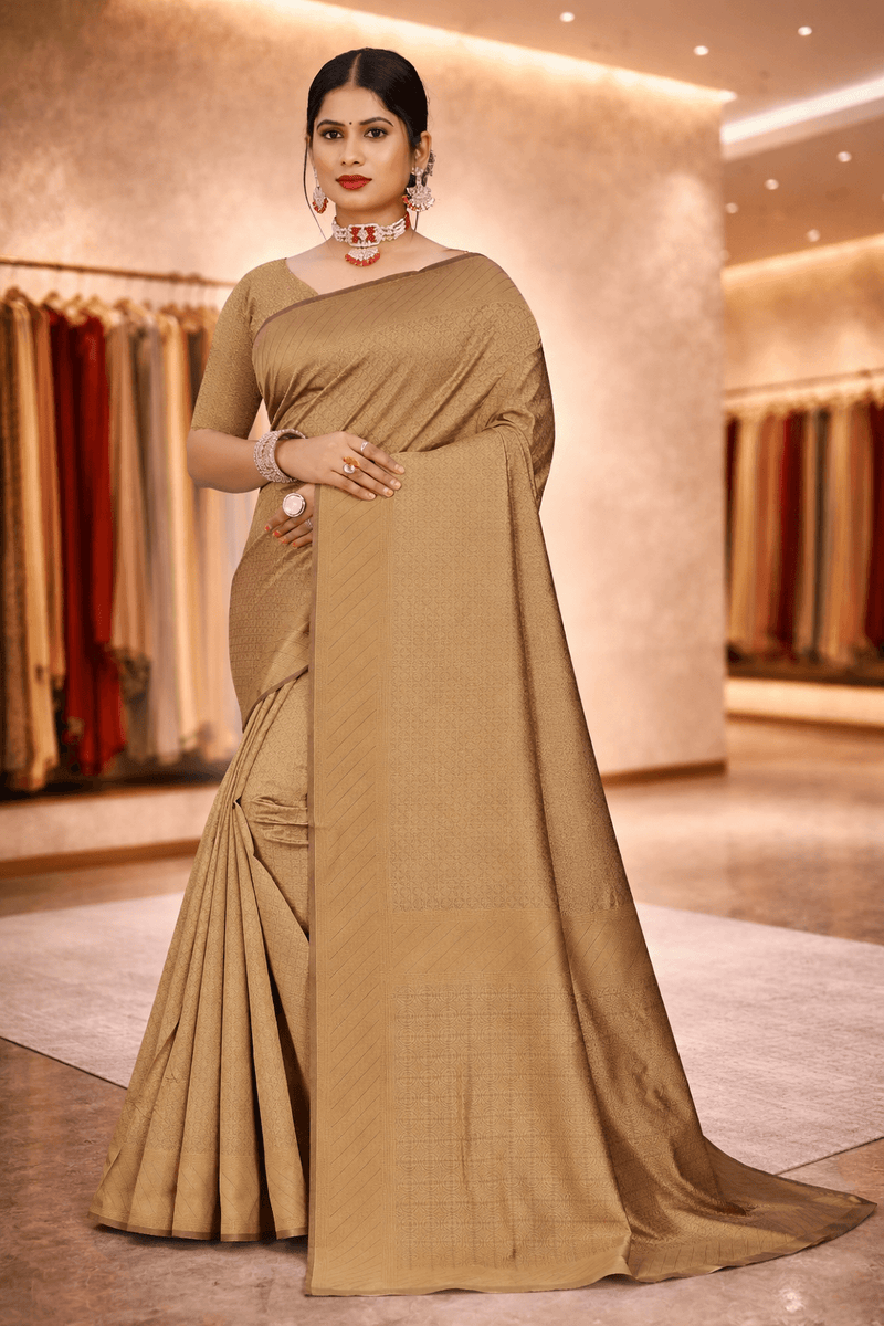 Full-length front pose showcasing the elegant drape and sheen of the antique gold minimalist saree