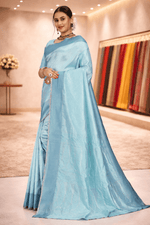 Elegant side drape showcasing the beautiful woven pallu and subtle sheen of the firozi blue saree