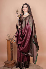 Elegant maroon silk saree with heavy zari pallu and vintage telephone