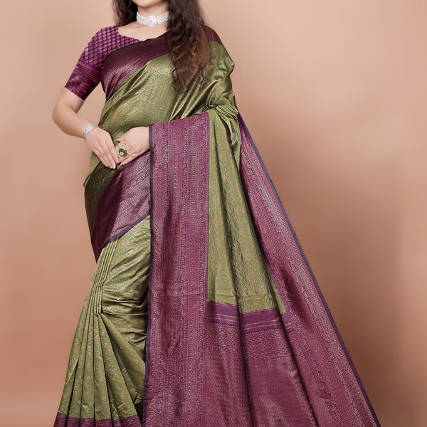 Full front view of a woman wearing a mehndi green and cherry red woven silk saree