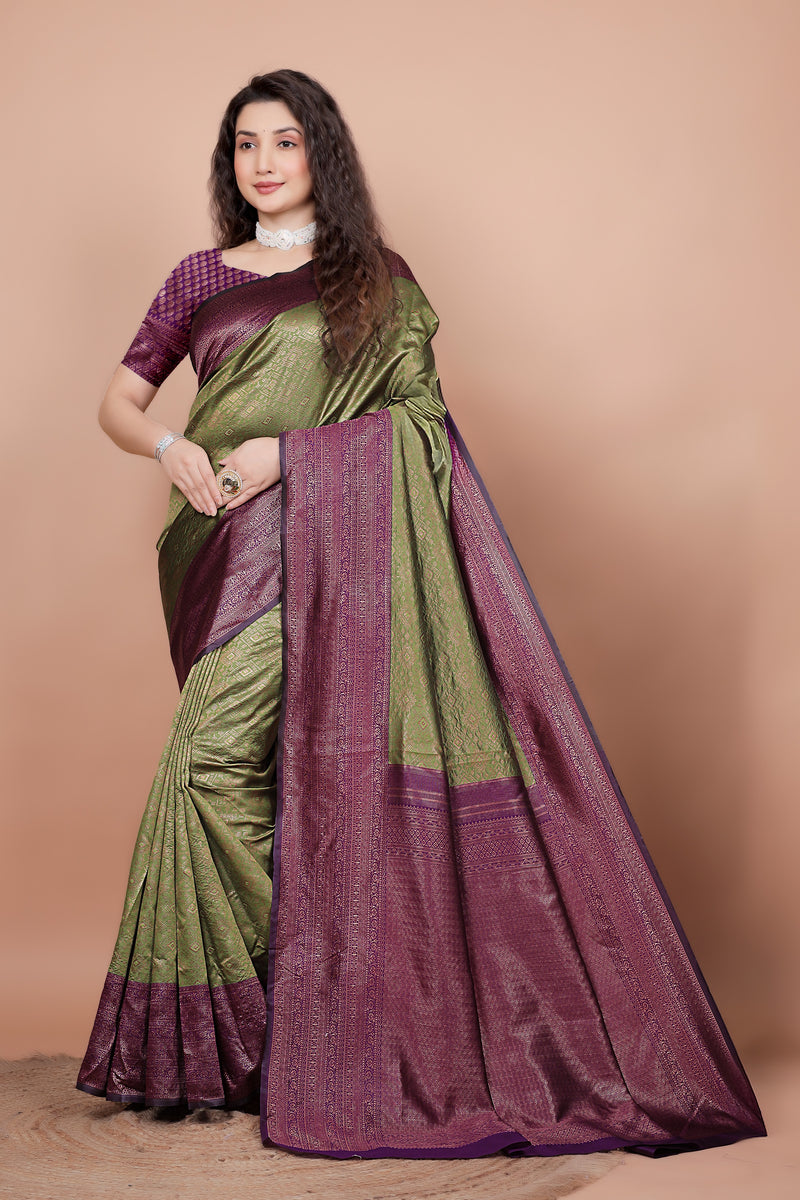 Full front view of a woman wearing a mehndi green and cherry red woven silk saree