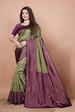 Full front view of a woman wearing a mehndi green and cherry red woven silk saree