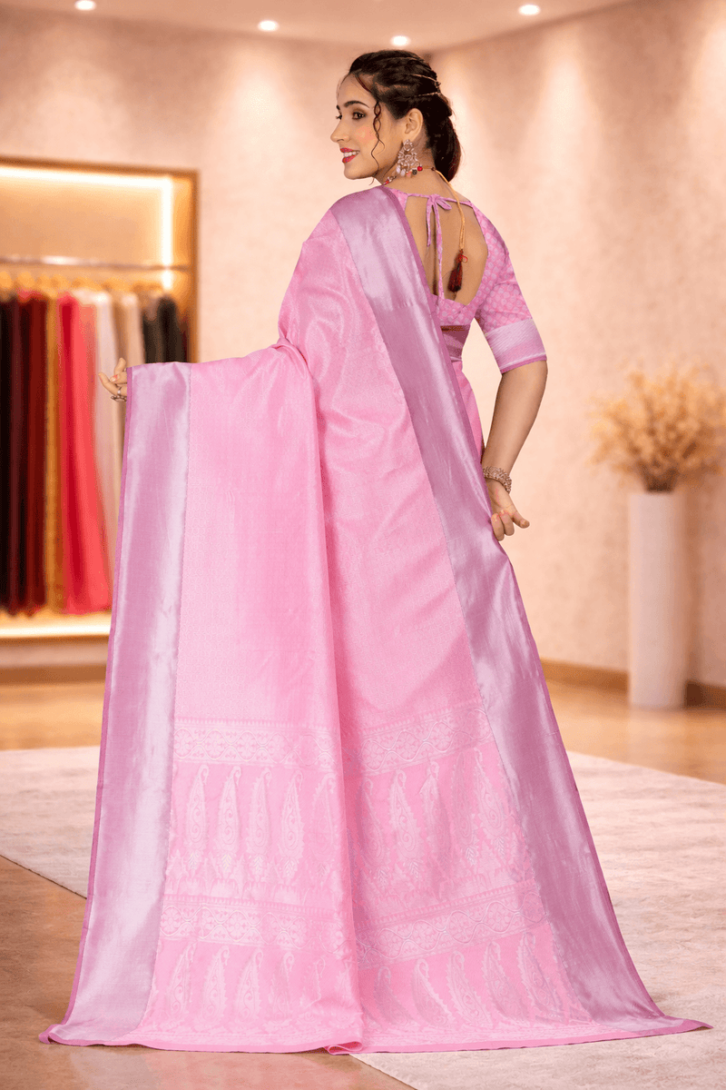 Back view highlighting the intricate paisley woven pallu and blouse design of the pink silk saree