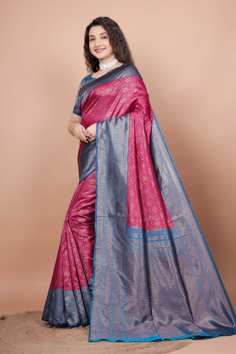 Side view of the rani pink saree displaying the detailed peacock blue pallu and pleats