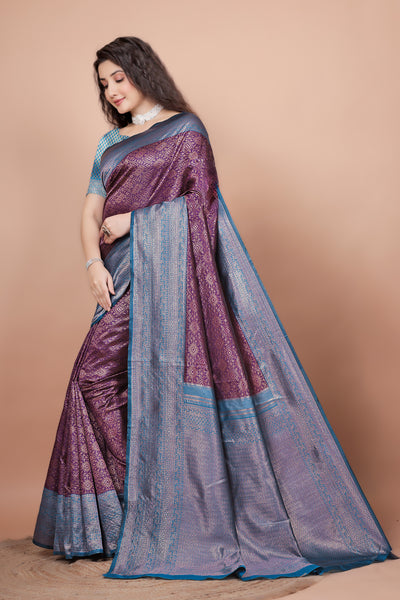 Side angle showcasing the contrasting peacock blue pallu and rich wine pleats