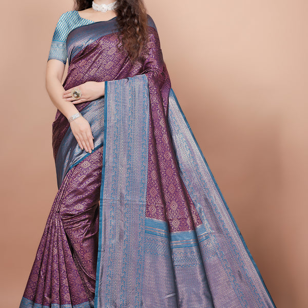 Full front view of a woman wearing a deep wine and peacock blue woven silk saree
